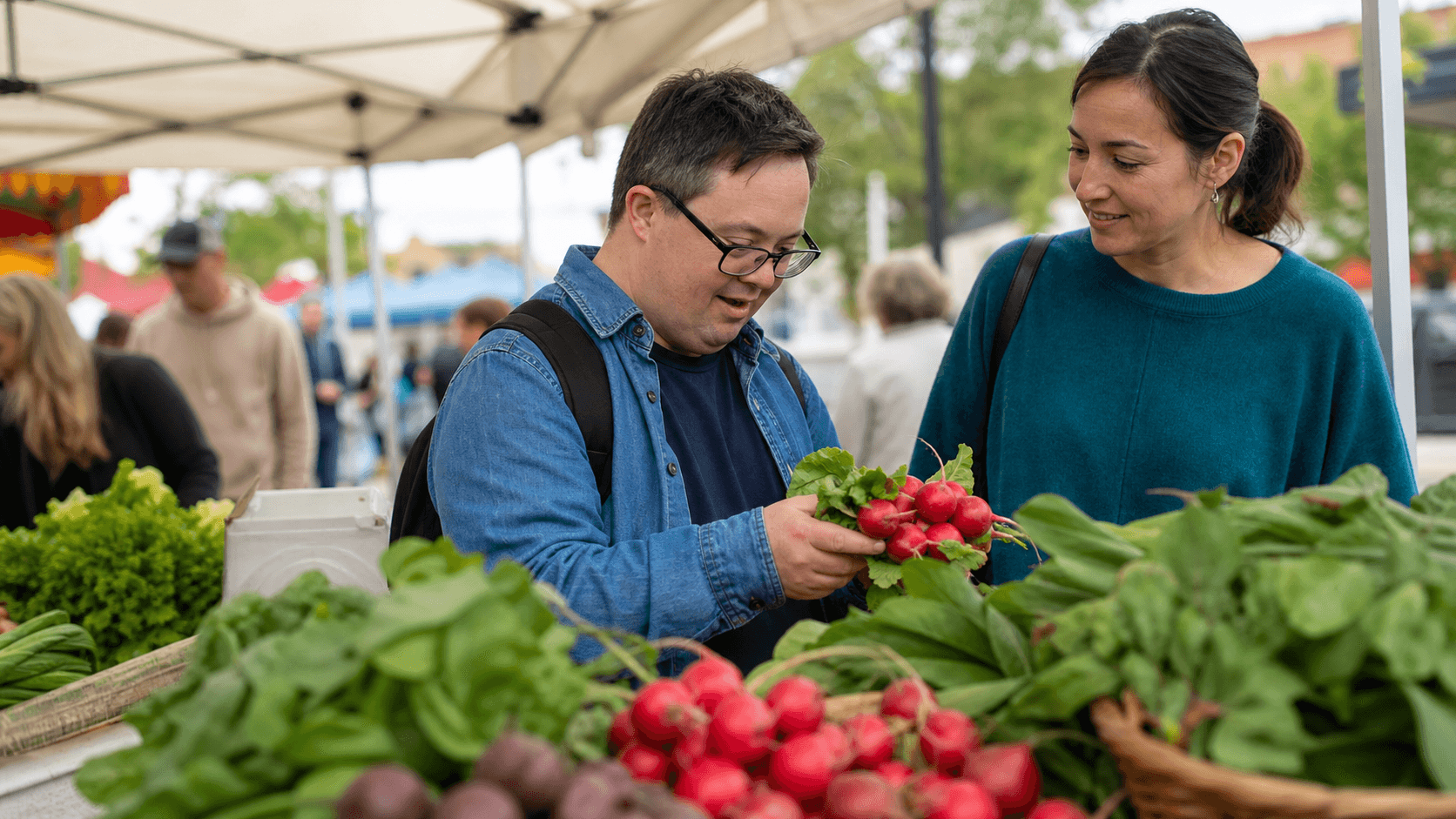 Participant choosing produce with support at a local community market